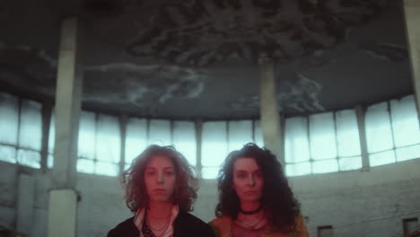 mysterious duo in an eerie abandoned building
