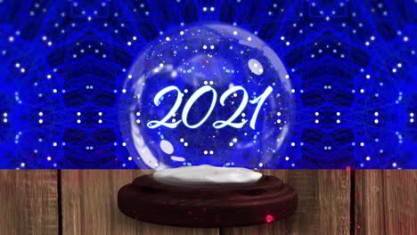 Animation-of-2021-in-snow-globe-on-wooden-boards,-shooting-star-and-snow-falling