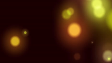 animación de manchas de luz amarillas brillantes que se mueven en movimiento hipnótico sobre un fondo negro