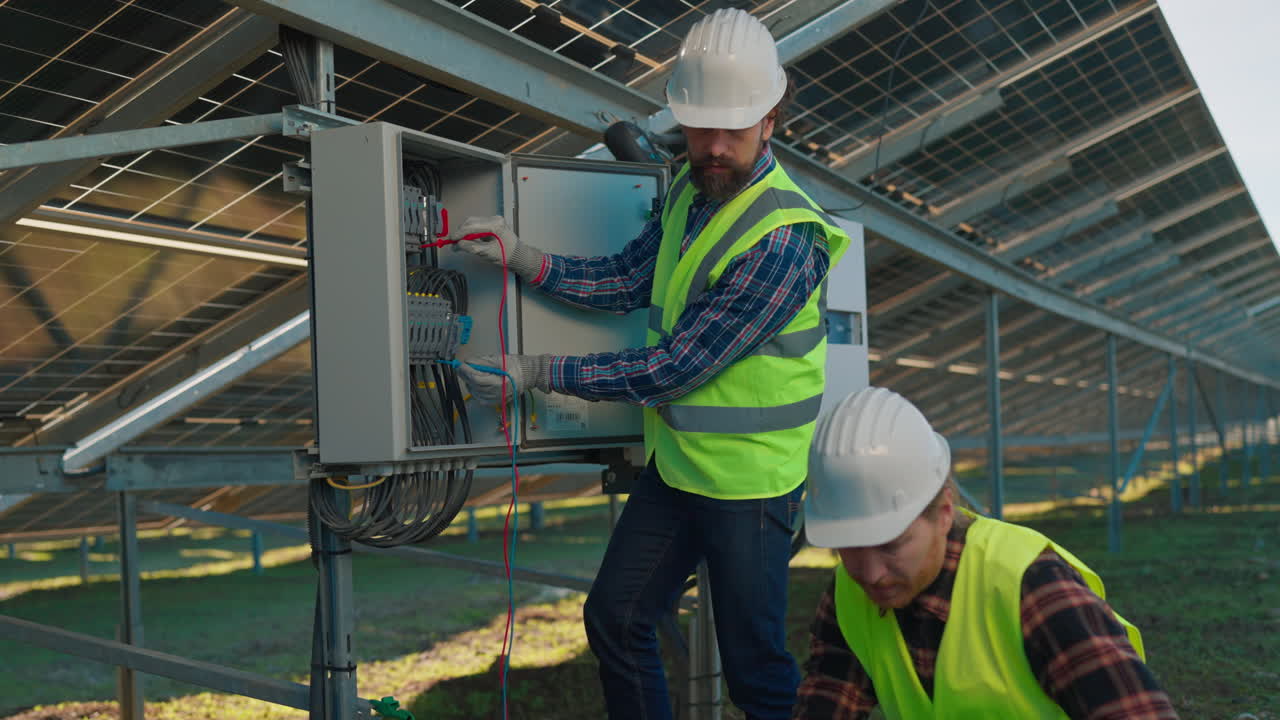 Engineer Inspecting Solar Panel Electrical System