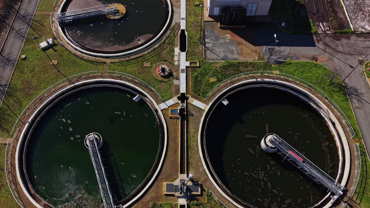 Active water treatment plant with large tanks and equipment