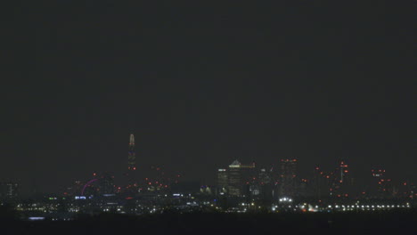 Take-off-at-London-airport-across-the-city-skyline-taken-from-a-distant-viewpoint