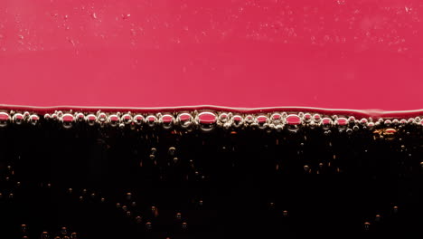 close-up of soda with bubbles and foam