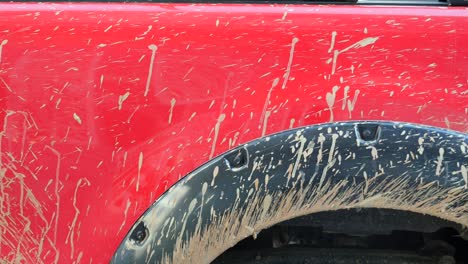 dirty red truck fender