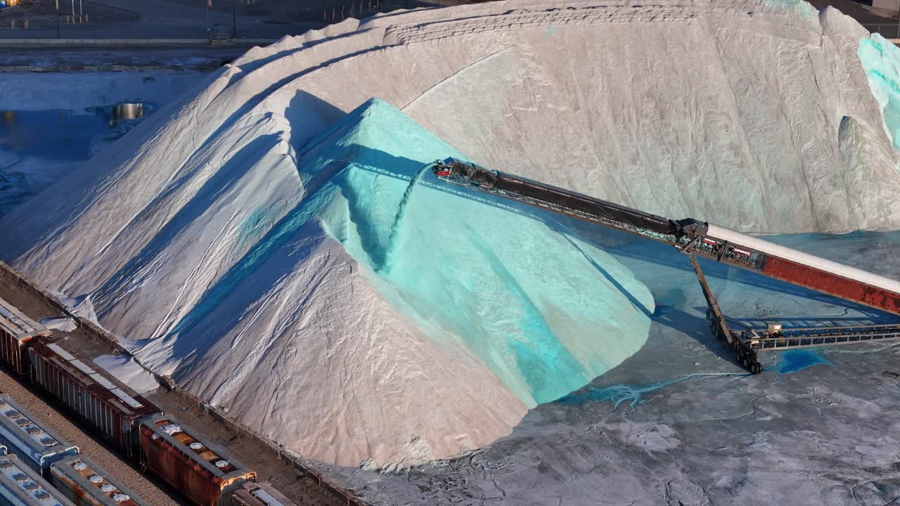 Large Pile of Salt with Train Cars