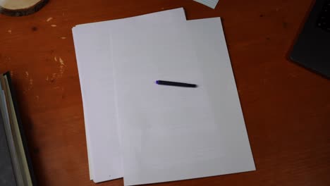 ink cartridge for a fountain pen is placed on a white paper and taken away