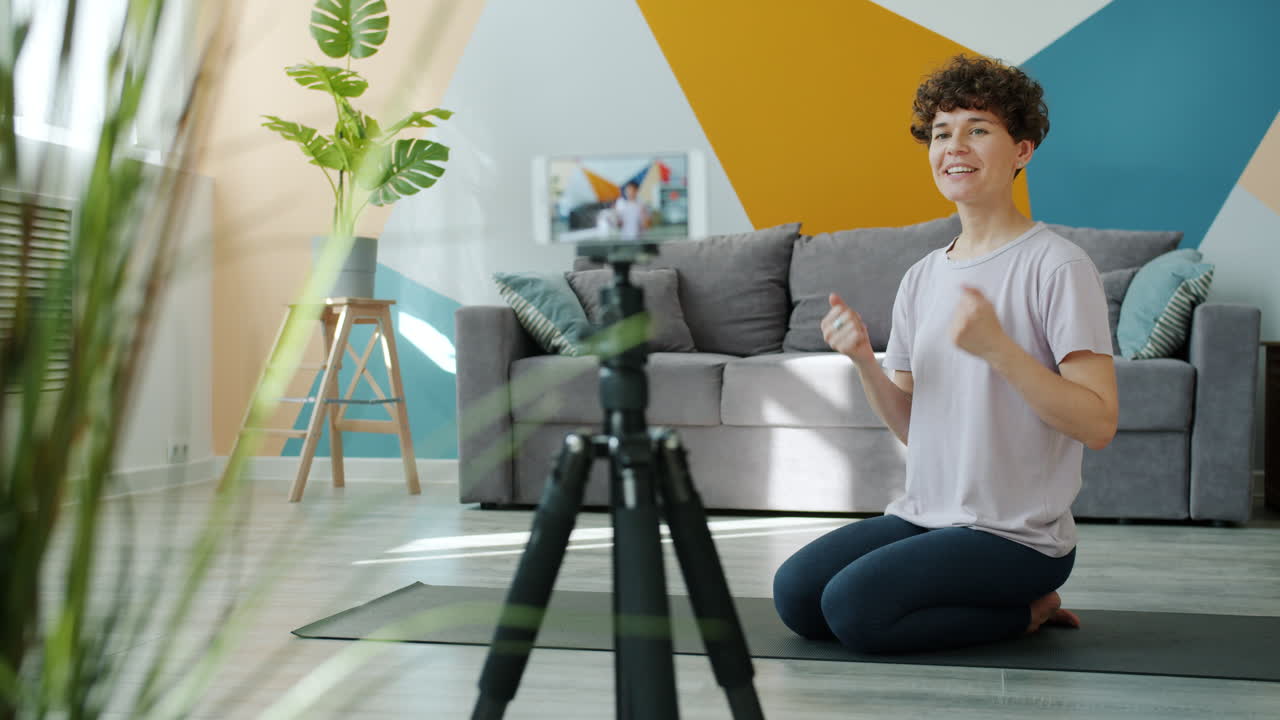 Woman leading yoga class at home