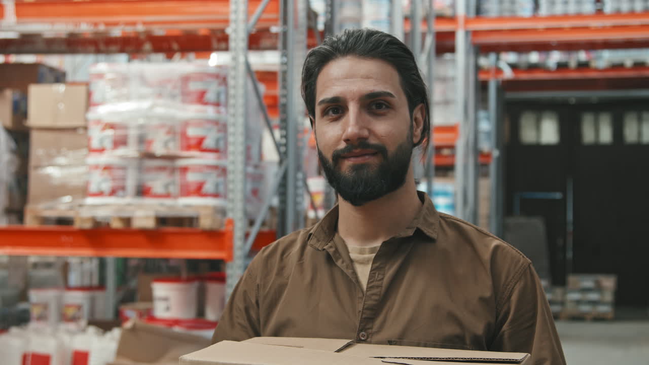 Guy Posing at Warehouse of Hardware Store