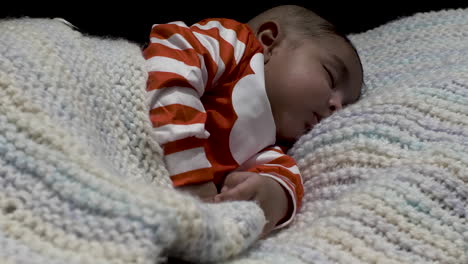 Cute-2-Month-Old-Baby-Asleep-On-Knitted-Blanket
