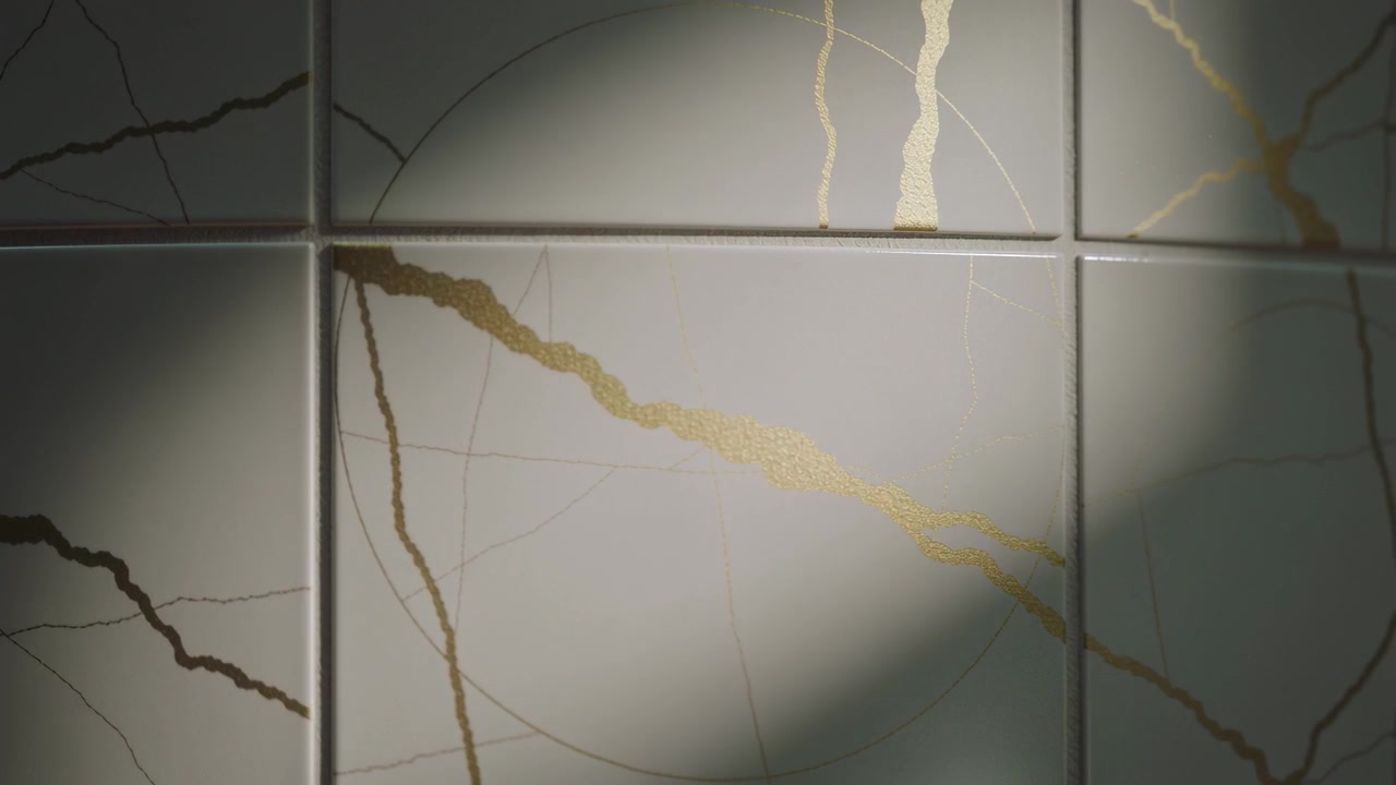 Sweeping soft-edged shadow crossing bathroom tiled wall, revealing gold vein, grout lines, etching
