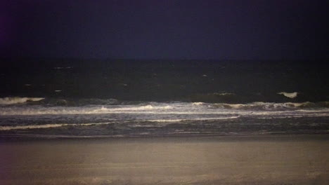 night beach waves gently break on a relaxing shore