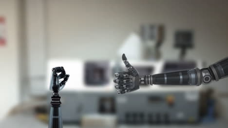 robot hands and blurred industrial background