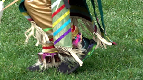 Slow motion of Native American's feet at Pow Wow ceremony.