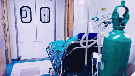 an unseen patient on a bed in the corridor of a hospital or emergency clinic awaiting treatment