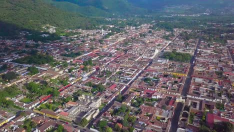 upper view of antigua city in a sunny day with a landscape of the volcano and mountains.