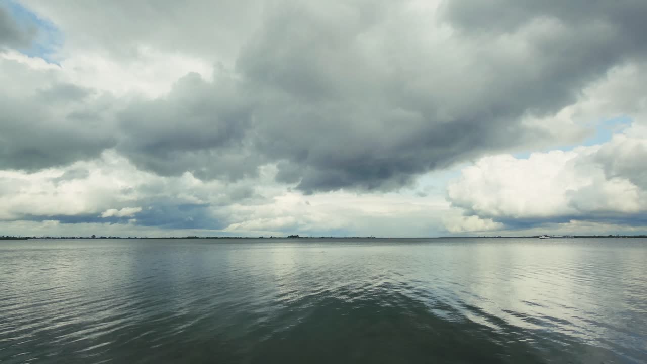 Reflection of clouds on the calm sea water
