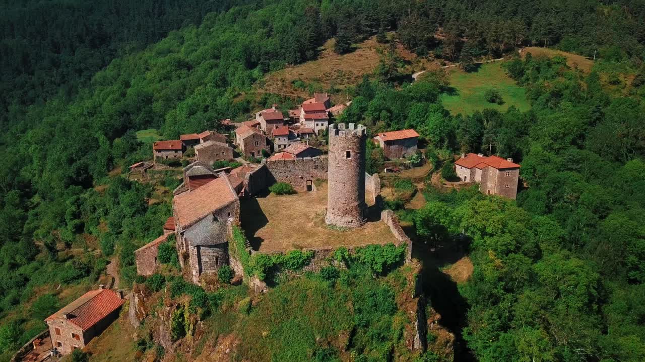 aerial shot over the castle of Chalencon in Haute Loire department during the day, auvergne rhone alpes region, France