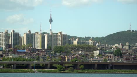 Namsan-Tower-over-Yongsan-district-viewed-from-the-bank-of-Han-river-iconic-landmark-of-Seoul-South-Korea,-also-know-as-N-Seoul-Tower,-YTN-Seoul-Tower-or-Seoul-Tower