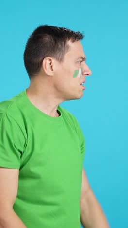 Man cheering for Nigeria, angry with the decision of referee