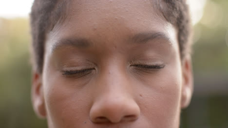 Portrait-close-up-happy-african-american-woman-smilling-in-garden,-in-slow-montion