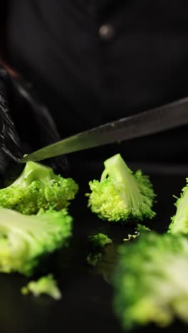 chef cutting broccoli