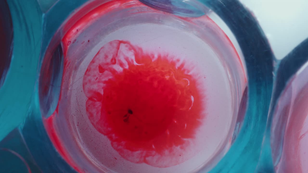 Extreme Close-Up of Adding Blood to Liquid during Medical Test