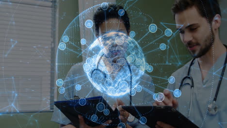 male doctor and female doctor reviewing medical data with holographic globe showing network icons