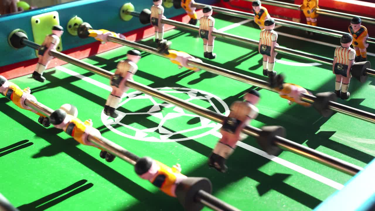 Close-up of a miniature soccer game, a typical game in Mexico with the sunset light