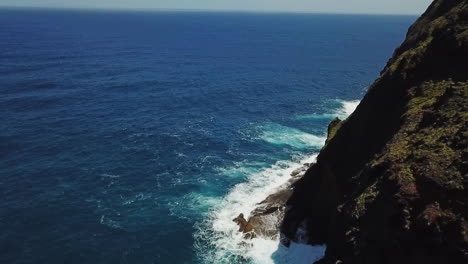 video of the open ocean in madeira with a small portion of a mountain visible on the right side