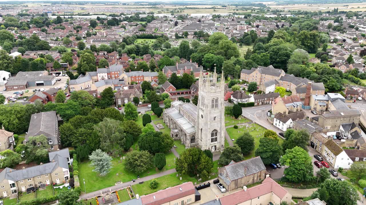Pull back drone aerial reverse reveal Saint Neots Parish Church Uk,