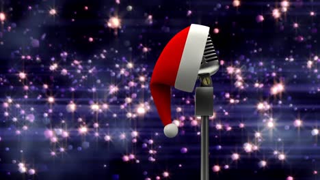 Santa-hat-over-microphone-against-spots-of-light-against-blue-background