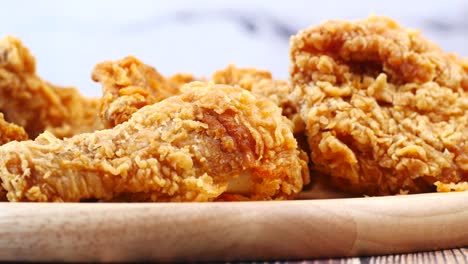 crispy fried chicken wings on a plate top view