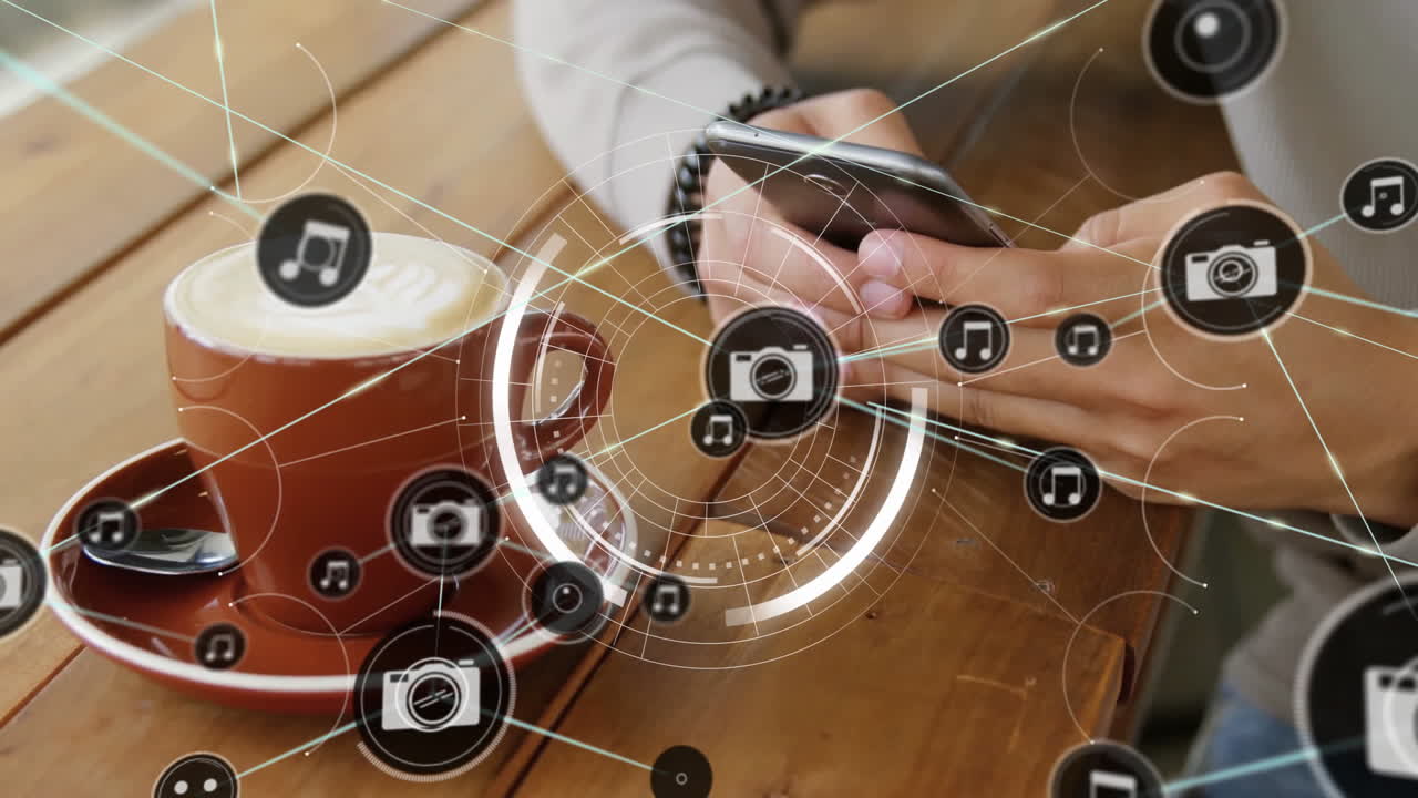 Using smartphone with animation digital icons, person having coffee on table
