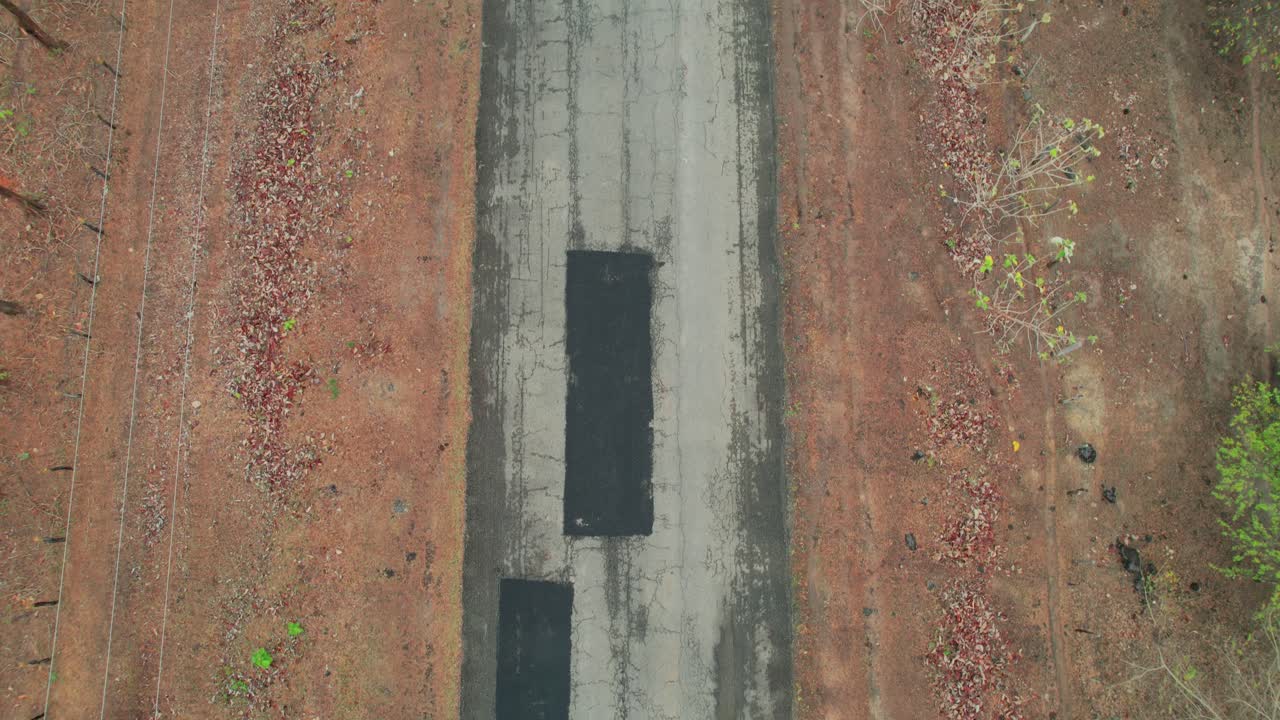 Cracked road in Los Esteros de Camaguán, Venezuela seen from above in dry season