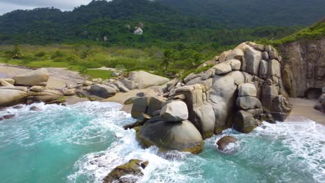 Coastal-rocks-and-forest-in-background,-aerial-drone-view