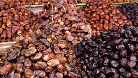 variety of fresh moroccan dates, shop display in the medina of marrakech (marrakesh), morocco. healthy food snacks, high in vitamins and protein. 4k food background footage.