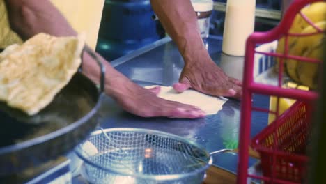 4K-Cinematic-cooking-footage-of-a-Thai-chef-preparing-a-traditionnal-Thai-dessert-called-Roti-in-a-street-market-in-Thailand