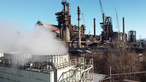 smoke rising from chimneys of steelmaking factory in trinec, czech republic