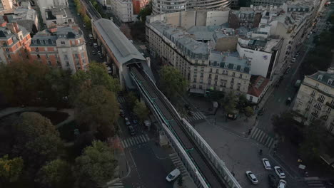 metro train passing on cambronne bridge in paris