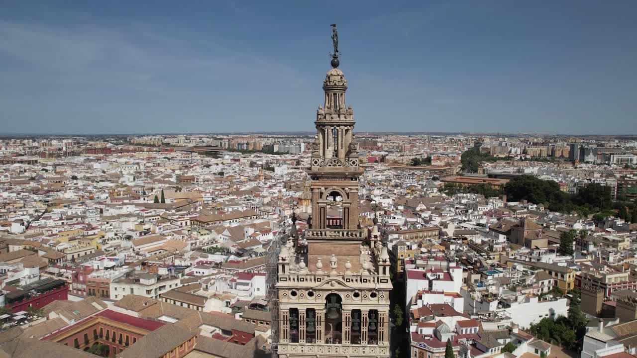 Aerial shot of Seville city center with gothic cathedral and famous Giralda bell tower