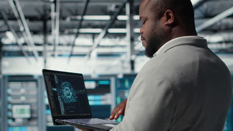 vertical video software developer in data center uses ai technology on laptop