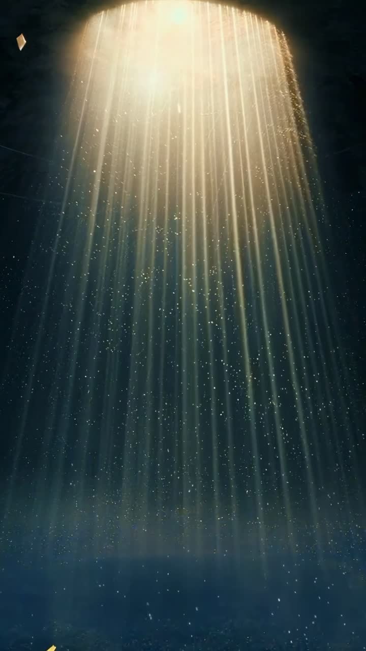 Aerial video angle capturing ethereal light beams and floating particles in a mystical ambiance