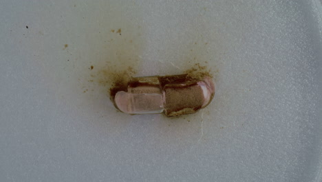 contaminated capsule on a surface