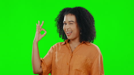 Ok,-wink-and-smile-with-woman-on-green-screen