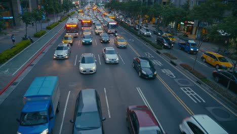 taipei, taiwan - a busy street in xinyi financial district of taipei city in the late evening