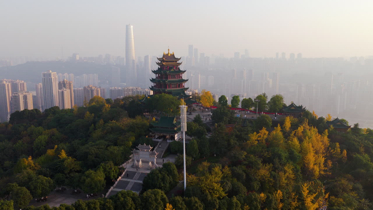 Hong'en Pavilion Park With The Modern High-rise City Against Hazy Backdrop In Chongqing, China. Aerial Rotate Shot