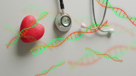 animación de cadenas de adn sobre el corazón y el estetoscopio