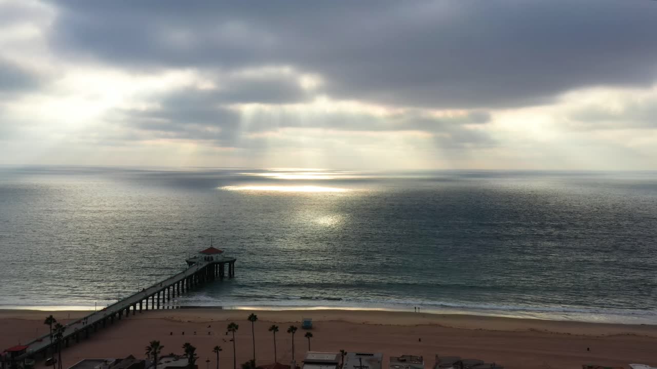 Scenic Aerial View Of Manhattan Beach Pier Under Cloudy Sky In California, United States