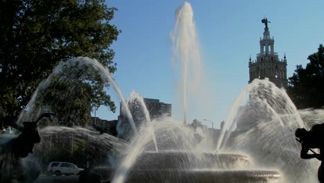 a downtown fountain in kansas city with buildings background