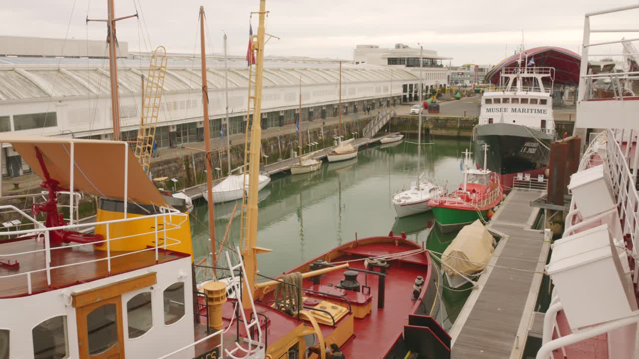 View of Boats and Ships Docked at a Maritime Museum Harbor
